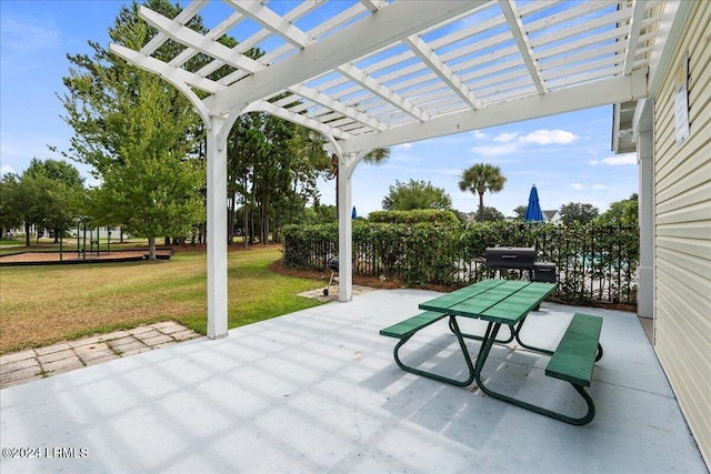 view of patio / terrace featuring area for grilling and a pergola