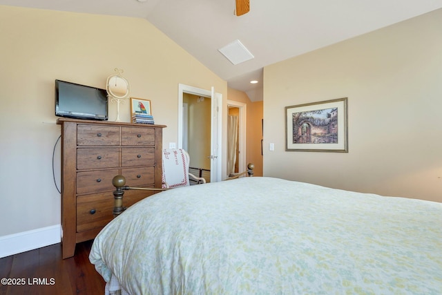 bedroom featuring dark wood-type flooring, vaulted ceiling, baseboards, and a ceiling fan