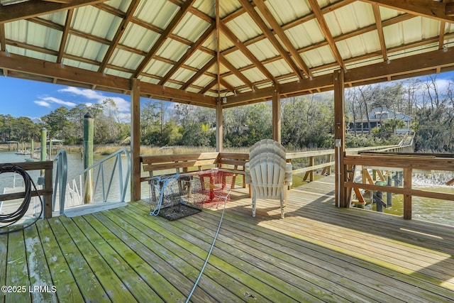 exterior space featuring vaulted ceiling and a water view