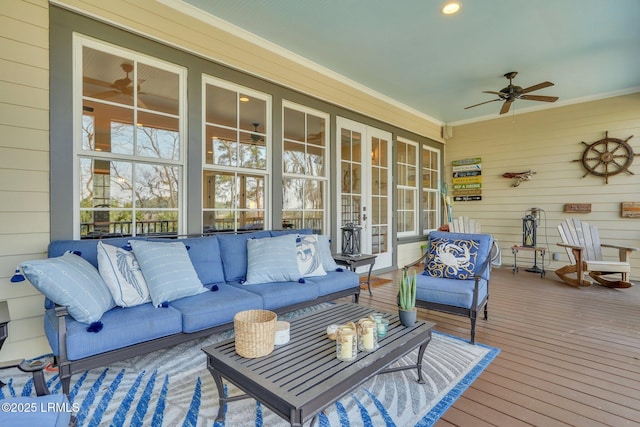 sunroom / solarium featuring a ceiling fan