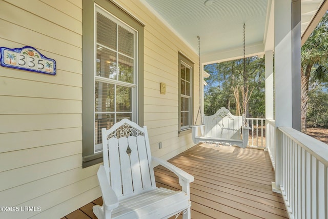 wooden terrace featuring a porch