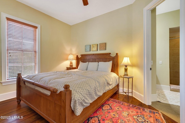 bedroom with ceiling fan, baseboards, and wood finished floors