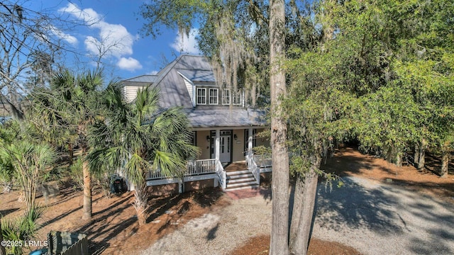 view of front of home featuring covered porch and metal roof