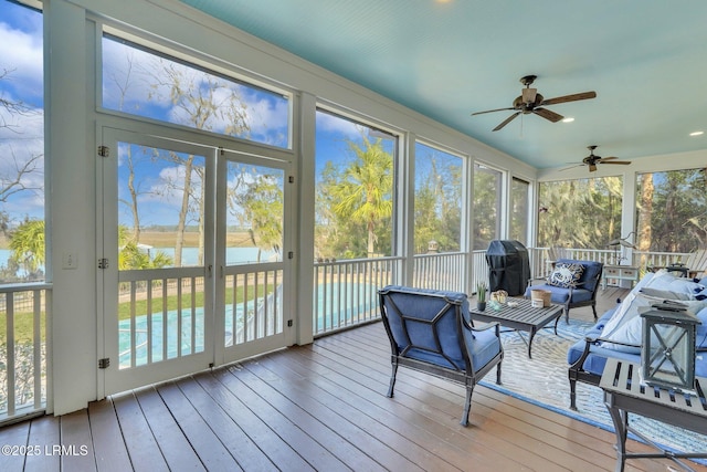 sunroom with a water view