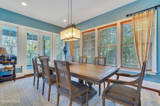 dining area with french doors, recessed lighting, wood finished floors, and baseboards