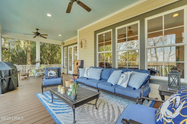 wooden deck with ceiling fan, an outdoor hangout area, and grilling area