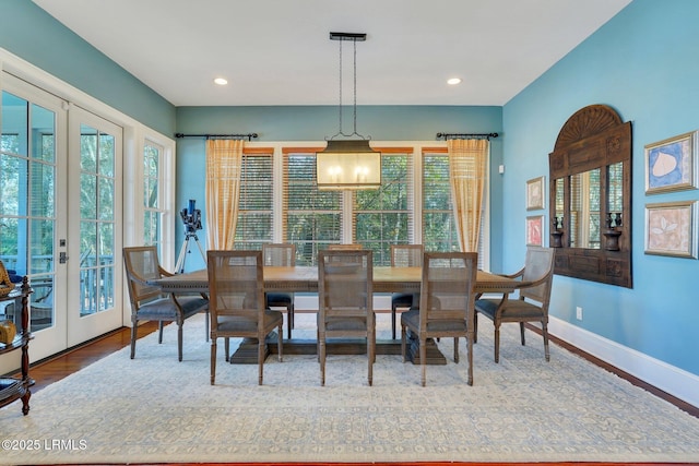 dining area with french doors, recessed lighting, wood finished floors, and baseboards