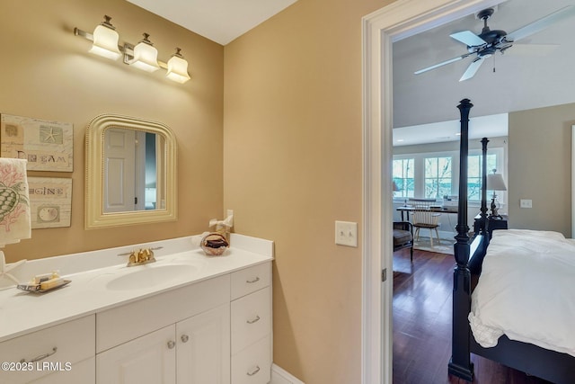 bathroom featuring a ceiling fan, vanity, and wood finished floors