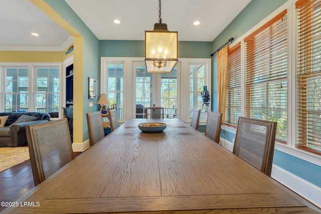 dining space with recessed lighting, wood finished floors, and baseboards