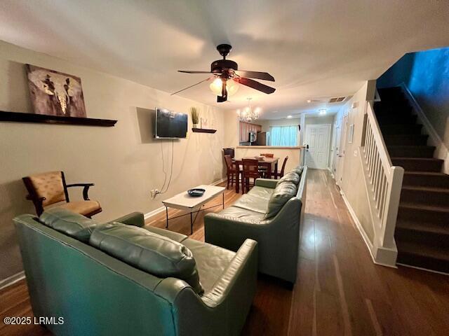 522 Candida Dr, Beaufort, SC 29906 - living area featuring a ceiling fan, stairs, wood finished floors, and baseboards