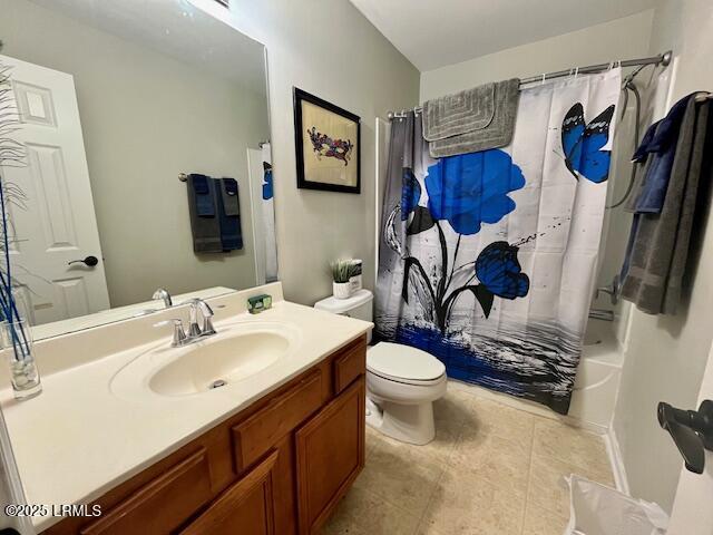 522 Candida Dr, Beaufort, SC 29906 - bathroom with tile patterned floors, vanity, toilet, and shower / bath combo with shower curtain