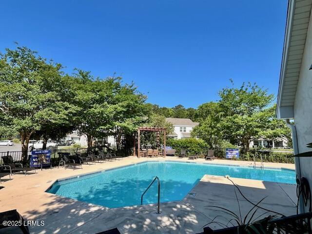 522 Candida Dr, Beaufort, SC 29906 - community pool featuring a patio area, fence, and a pergola