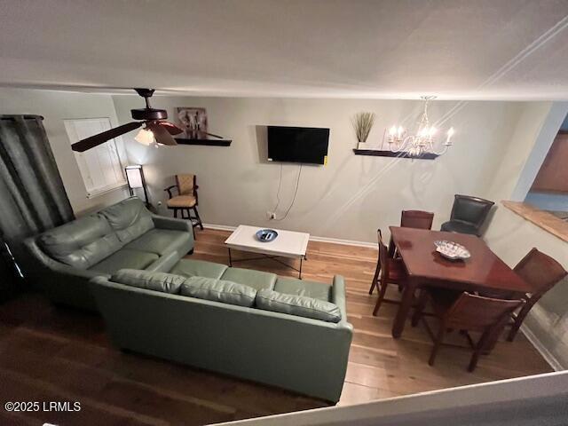 522 Candida Dr, Beaufort, SC 29906 - living area with wood finished floors, a ceiling fan, a chandelier, and baseboards