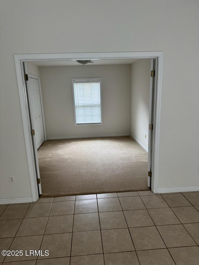 120 Crossings Blvd, Bluffton, SC 29910 - unfurnished room with light colored carpet, light tile patterned flooring, and baseboards