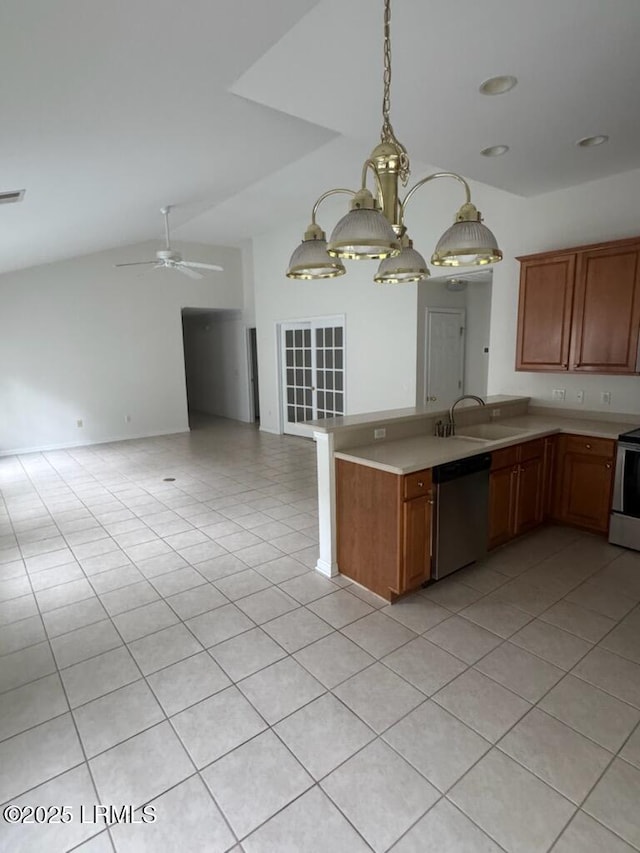 120 Crossings Blvd, Bluffton, SC 29910 - kitchen featuring stainless steel appliances, a sink, vaulted ceiling, light countertops, and a peninsula
