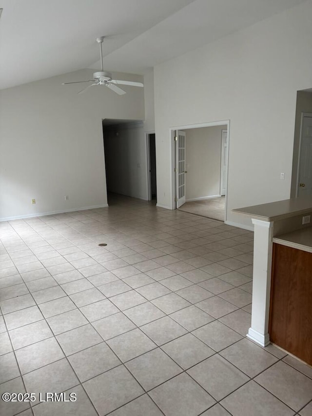 120 Crossings Blvd, Bluffton, SC 29910 - empty room featuring high vaulted ceiling, a ceiling fan, light tile patterned floors, and baseboards