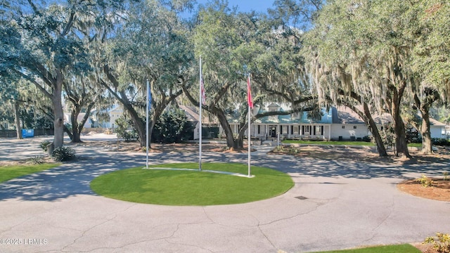 view of property's community featuring aphalt driveway