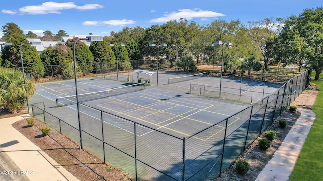 view of sport court with fence