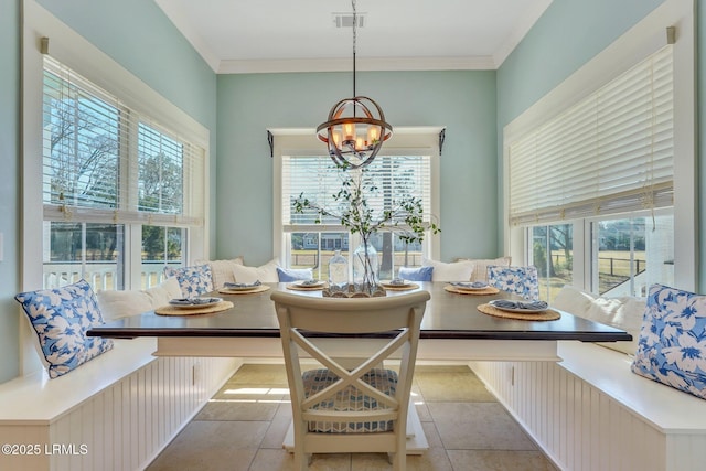 dining space featuring visible vents, breakfast area, ornamental molding, an inviting chandelier, and tile patterned flooring