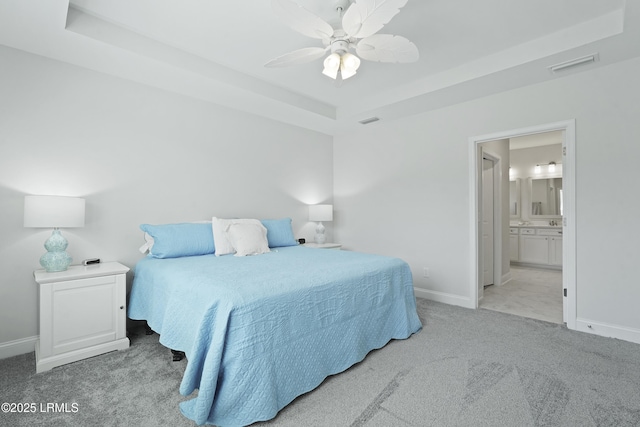 821 Aurora Way, Bluffton, SC 29909 - carpeted bedroom featuring baseboards, a raised ceiling, ensuite bathroom, and ceiling fan