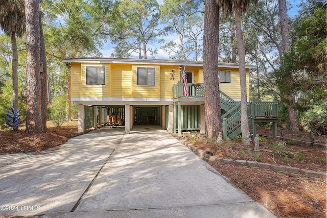 view of front of property featuring a carport