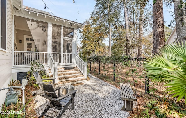 view of yard with a patio and a sunroom