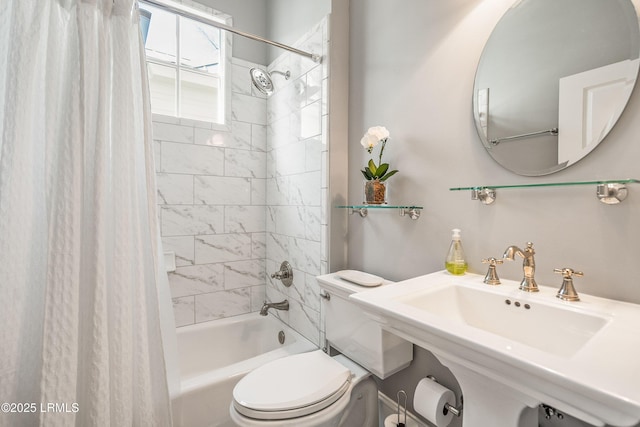 full bathroom with sink, toilet, and shower / tub combo