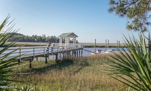 dock area with a water view and a gazebo