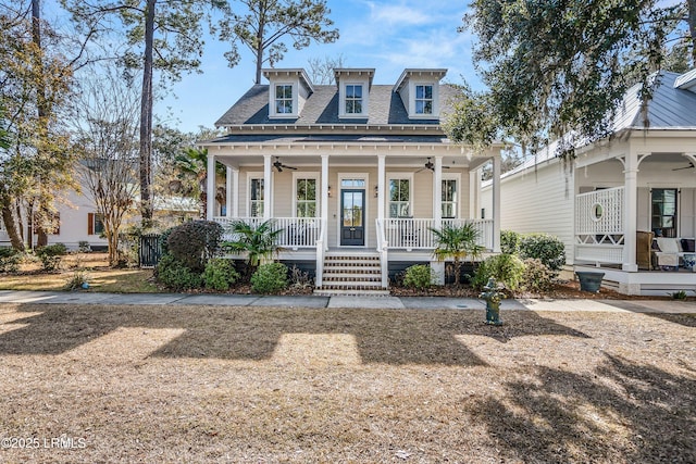 view of front of property featuring ceiling fan and a porch