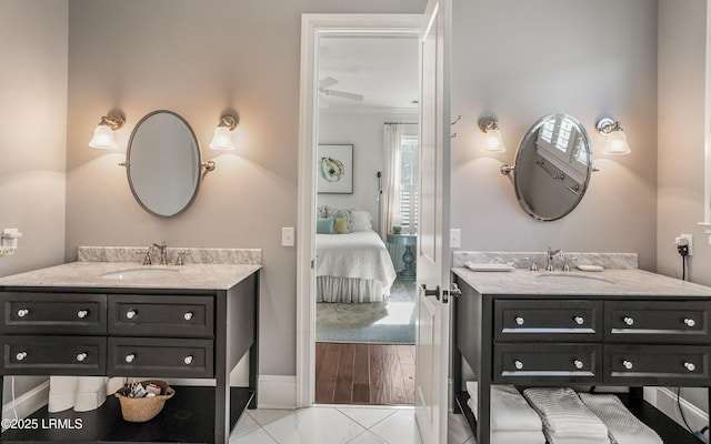 bathroom with vanity and ornamental molding