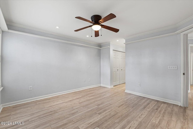 spare room featuring crown molding, ceiling fan, and light hardwood / wood-style flooring