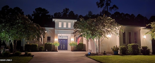 view of front of home with a yard