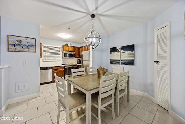 663 William Hilton Pkwy Unit 3410, Hilton Head Island, SC 29928 - dining area featuring baseboards, a chandelier, and light tile patterned flooring