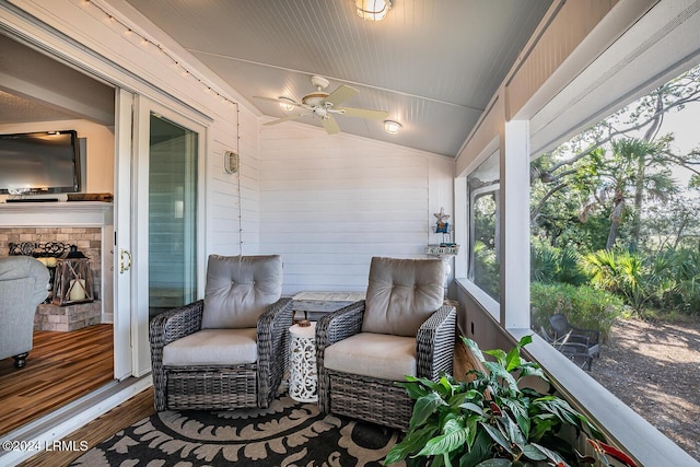 sunroom / solarium featuring vaulted ceiling and ceiling fan