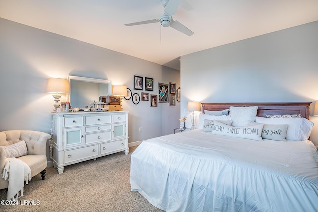 bedroom featuring light carpet and ceiling fan