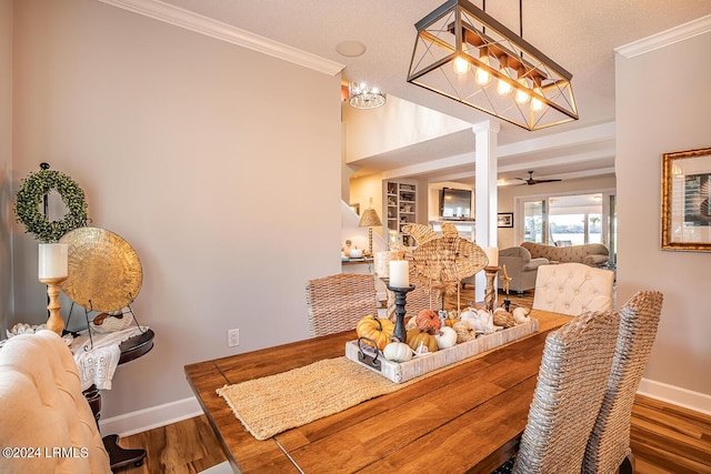 dining area with decorative columns, ornamental molding, and dark hardwood / wood-style flooring