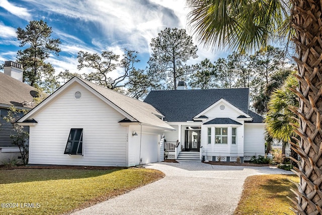 view of front facade with a garage and a front yard