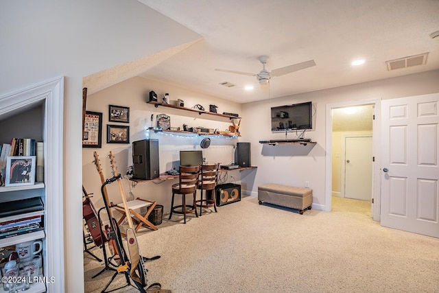 interior space with light colored carpet and ceiling fan