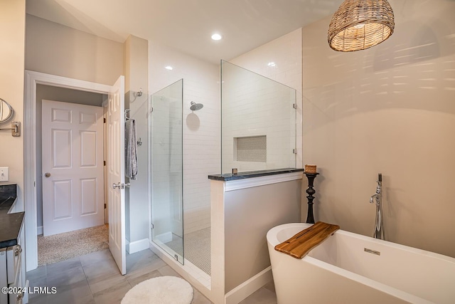 bathroom with separate shower and tub