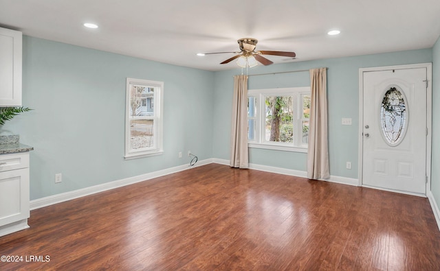 entrance foyer featuring dark wood-type flooring and ceiling fan