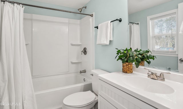 full bathroom with vanity, shower / bathtub combination with curtain, and toilet