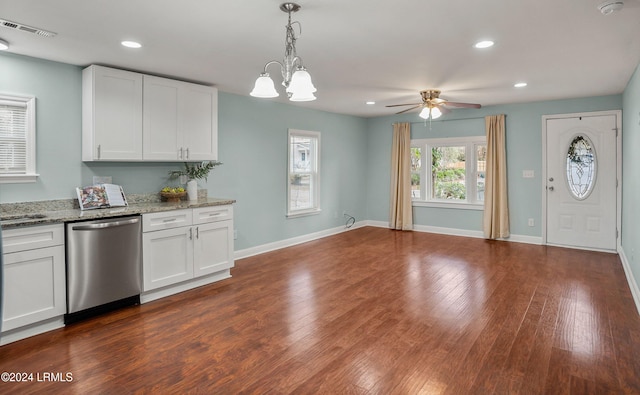 kitchen with dark wood-type flooring, dishwasher, hanging light fixtures, light stone countertops, and white cabinets