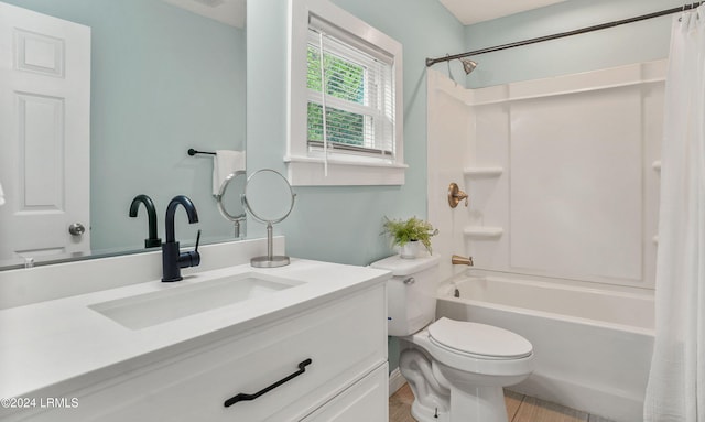 full bathroom featuring toilet, vanity, and shower / bathtub combination with curtain