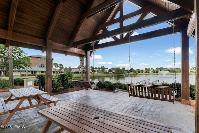 wooden deck with a water view