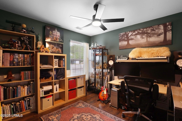 office space with ceiling fan, wood finished floors, and visible vents