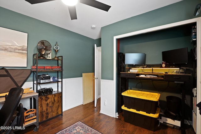 office with a ceiling fan, wainscoting, and wood finished floors