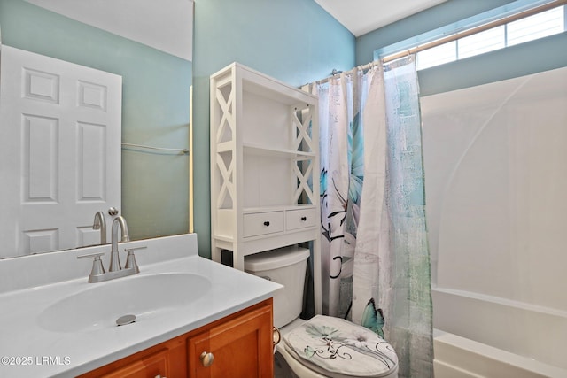 full bath featuring toilet, shower / bath combination with curtain, and vanity