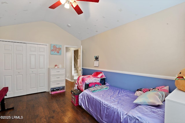 bedroom with a ceiling fan, a closet, wood finished floors, and lofted ceiling