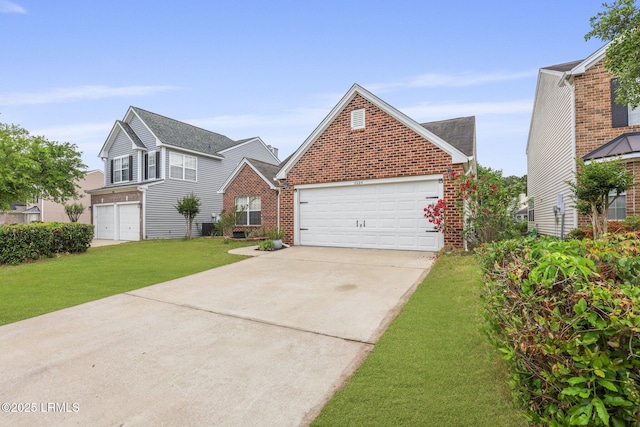 traditional home featuring a garage, concrete driveway, a front lawn, and brick siding