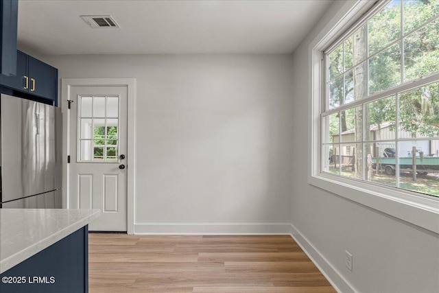1807 Battery Park Dr, Port Royal, SC 29935 - doorway to outside featuring light wood-style flooring and baseboards